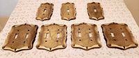 All seven Amerock Carriage House switch plates front view