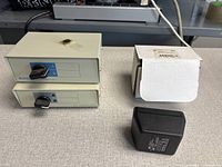 Front view of two Manhattan A/B data switch boxes and Hammond power supply with box
