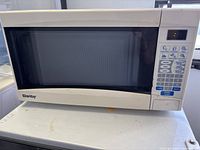Front view of Danby microwave showing exterior, control panel and brand marking