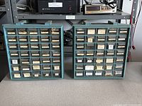 Both teal plastic parts cabinets showing all drawers labeled and filled