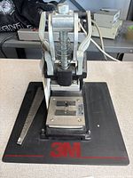Full front/top view of press on base with alignment bar
