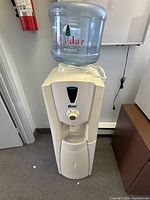 Front view of water cooler with Cedar Springs bottle attached