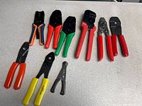 Group shot of all ten wire crimpers showing styles, sizes and handle colors