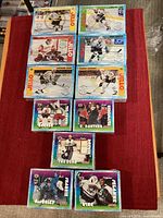 All 11 sealed 1996 NHL Jell-O boxes arranged on surface