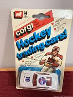 Front view of sealed Corgi Winnipeg Jets Porsche Carrera on card