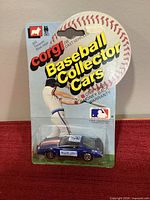 Front view sealed Corgi Baseball Collector Cars package with car visible
