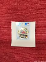 Front view of sealed 1991 Toronto All-Star Game enamel pin on backing card
