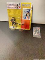 Front view of sealed Starting Lineup Pavel Bure figure and separate sealed Post Pinnacle card