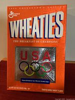 Front view of sealed 1996 Collector’s Edition Wheaties cereal box showing USA Olympic team design