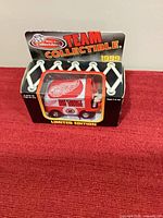 Front view of sealed 1999 Team Collectible Detroit Red Wings Zamboni in packaging
