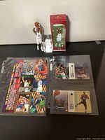 Full lot showing Karl Malone ornament, box, two 1995 NBA promo sheets in sleeves
