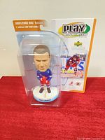 Front view of sealed Eric Lindros bobblehead in original packaging