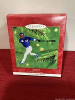 Front of red Hallmark Keepsake box showing image of ornament