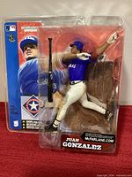 Front view of sealed Juan Gonzalez SportsPicks figure in blister pack