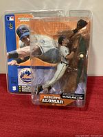 Front view of sealed Roberto Alomar SportsPicks figure in packaging
