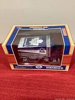 Sealed boxed 1:24 Toronto Maple Leafs Zamboni bank showing front and side graphics