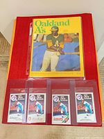 Program and four pocket schedules laid out on surface