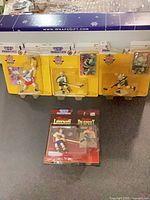 Front view of all four sealed Starting Lineup hockey figures in original 1995 packaging