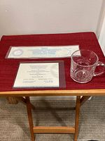 Group shot showing invitation, rectangular item, and etched glass mug