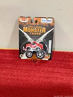 Front view of sealed Detroit Red Wings mini monster truck in original packaging
