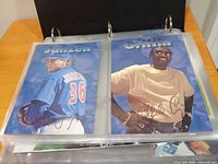 Binder page with Janzen and Griffin 1997 Sizzler Blue Jays oversized photo cards