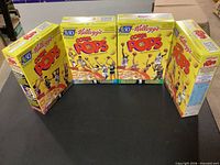 Front view of four Corn Pops boxes standing side by side