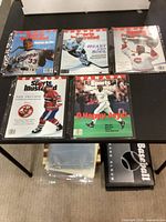 Five Sports Illustrated Canada magazines in sleeves on table