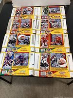 All eight uncut Lunchables Goalie Greats panels arranged flat