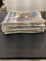 Side view of bundled stack of sports newspapers