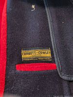 Corbett-Cowley interior label on navy wool with red lining