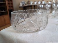 Side view showing starburst and fan cut designs and scalloped rim