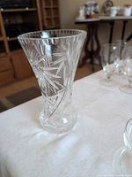 Front view of 10" clear crystal vase showing cut starburst pattern