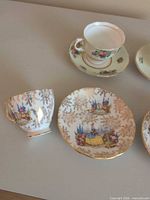 Close-up of gilt leaf pattern cup and saucer