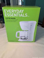 Front of factory-sealed Everyday Essentials coffee maker box