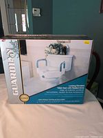 Front of retail box showing Guardian Select locking elevated toilet seat imagery and features