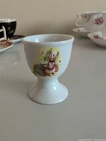 Front view of porcelain egg cup showing rabbit decal