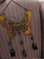 Front view of painted butterfly wind chime