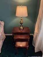Front view of all three nesting tables stacked