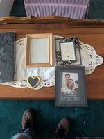 Album and frames on table