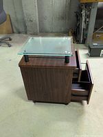 Printer stand side view showing drawers extended and glass top