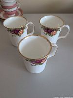 Three Royal Albert Old Country Roses teacups front view