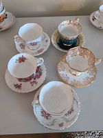 All five tea cup and saucer sets displayed