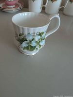 Side view showing Trillium floral pattern and gold trim