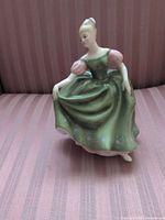 Front view of Royal Doulton Michele figurine in green dress