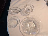 Top view showing all four clear glass bowls highlighting individual patterns and shapes