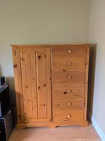 Front view of solid pine armoire wardrobe closed