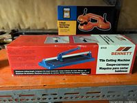 Front of Bennett tile cutting machine box showing product image and specifications