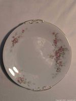 Front view of rose floral bread & butter plate