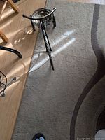 Side view of entire tricycle plant stand on floor