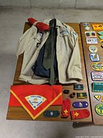 Uniform shirt, necktie, neckerchief, red socks, epaulette loops, beginning of patch spread
